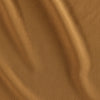 Amber colored crepe fabric made from 100 percent viscose.