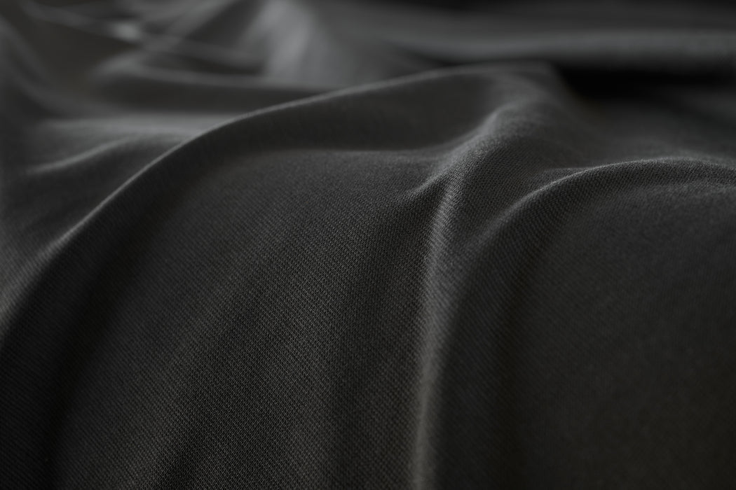 Black colored fabric made with Rayon from bamboo, cotton, and spandex.