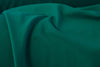An evergreen colored matte finish nylon tricot fabric made from nylon and lycra.