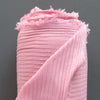Taffy pink colored ribbed knit fabric made from rayon and lycra.